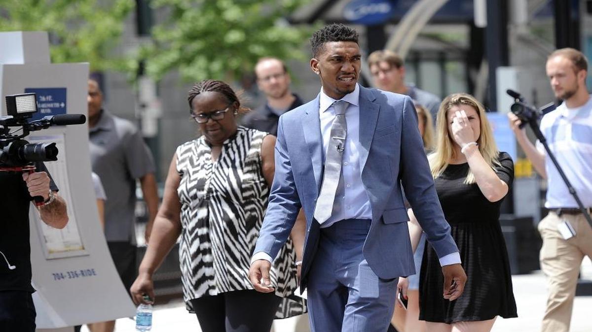 Charlotte Hornets draft pick Malik Monk takes a walk on the streets of Charlotte Friday along with his mother, Jackie Monk, left, who raised him in Arkansas with considerable help from Monk’s older brother Marcus.