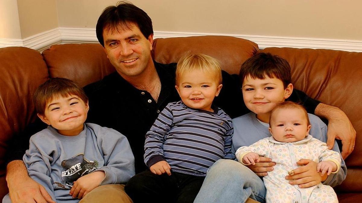 In 2002, former UNC and Independence High quarterback Mark Maye posed for The Observer at his Huntersville home with his four sons. From left to right: Cole, Beau and five-year-old Luke Maye, holding his youngest brother Drake.