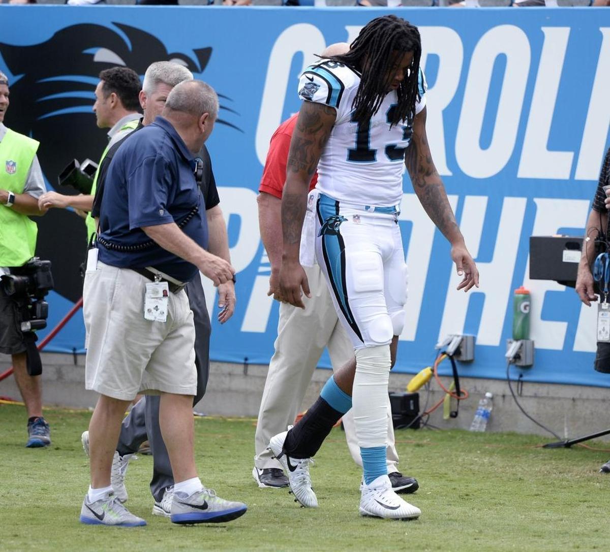 Carolina Panthers wide receiver Kelvin Benjamin (13) walks off the field in the second quarter after leaving the game with a knee injury against New Orleans Sunday. Benjamin did not return to the game after being pulled down from behind and going down awkwardly.