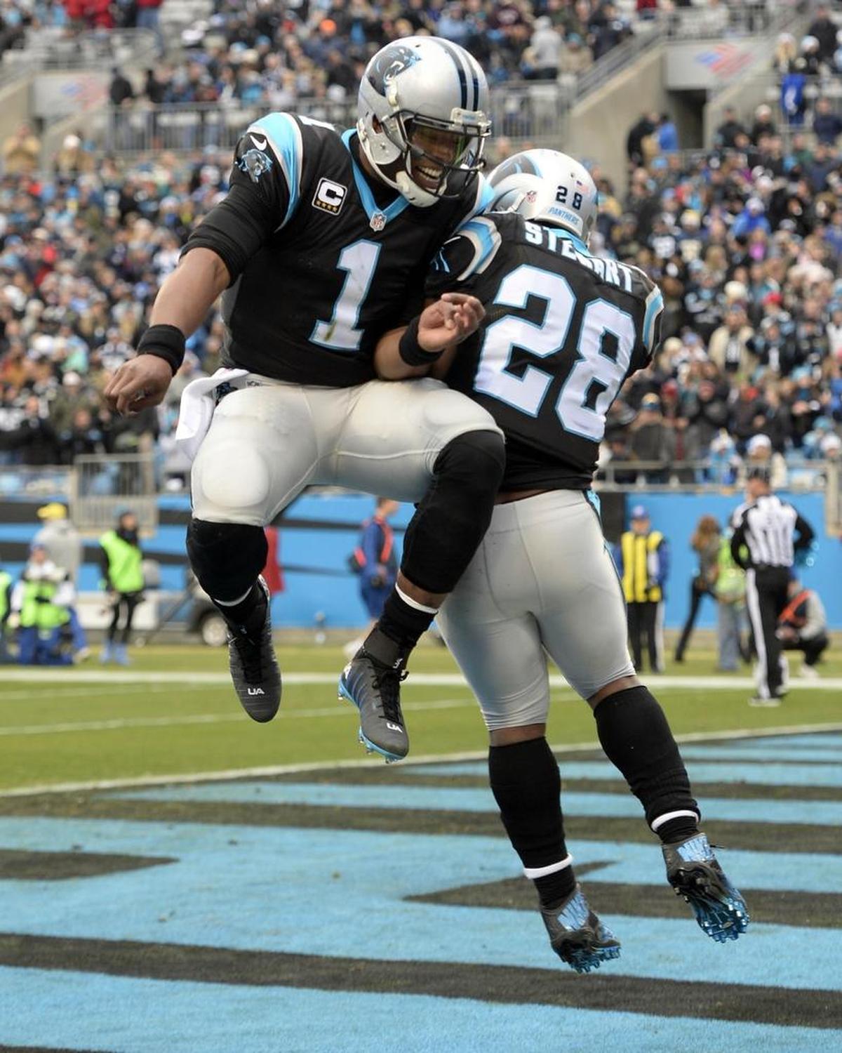 Carolina Panthers quarterback Cam Newton (1) celebrates with running back Jonathan Stewart in 2016. Newton’s practice time has been limited since August due to his surgically repaired throwing shoulder.