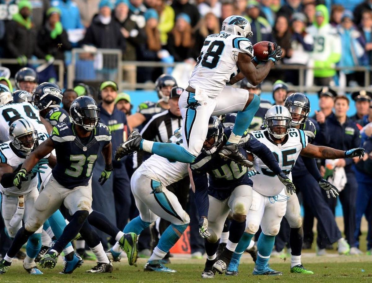 Panthers linebacker Thomas Davis leaped into the air to recover an onside kick by Seattle on Jan. 17, 2016, to clinch a playoff win for Carolina.