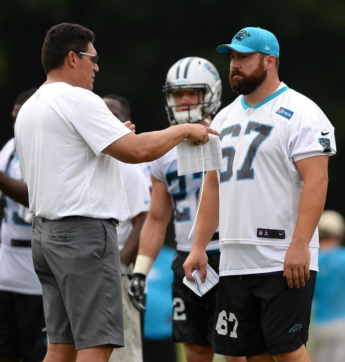 Ron Rivera (left) and former Panthers center Ryan Kalil have both bought full-page newspaper ads to get their message across -- Kalil used his ad in 2012 to incorrectly predict a Super Bowl win.