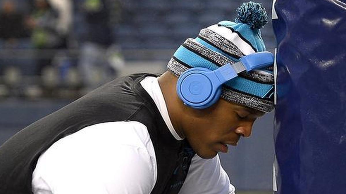
Carolina Panthers quarterback Cam Newton, shown in a quiet moment before the Seattle playoff game in January, needs in particular to improve his completion and winning percentage in 2015. 
