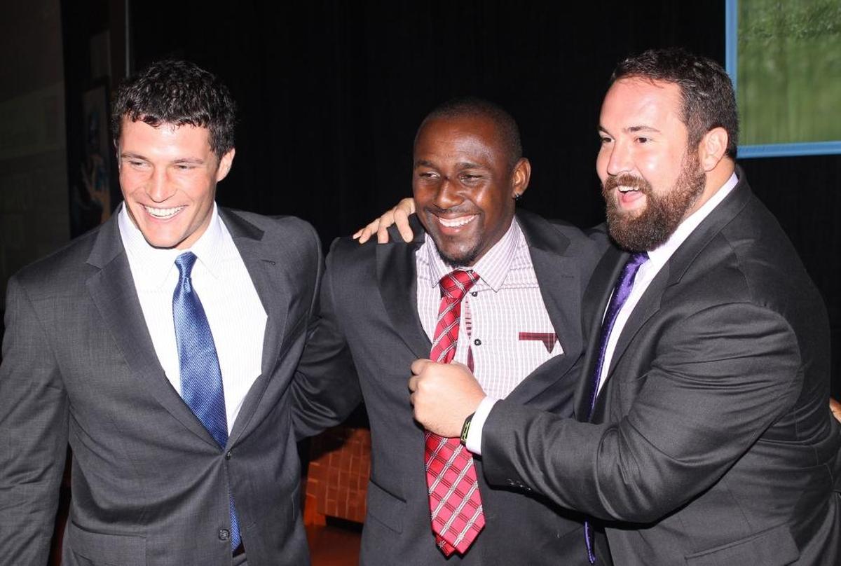 In 2014, Panthers Luke Kuechly (left), Thomas Davis (center) and Ryan Kalil made an appearance at a preseason luncheon honoring the team.