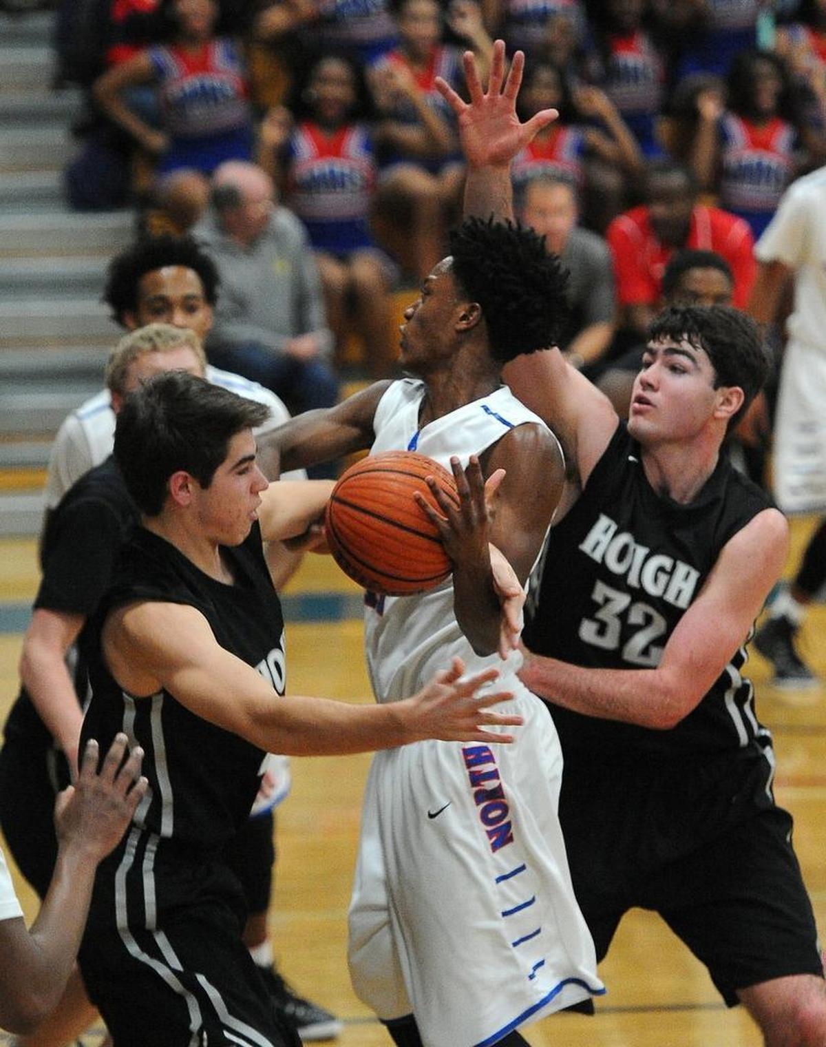Cole Maye (left) and Luke Maye (32) played basketball together in high school at Hough. In 2015, they double-teamed North Mecklenburg’s C.J. Bryce in a high school game.