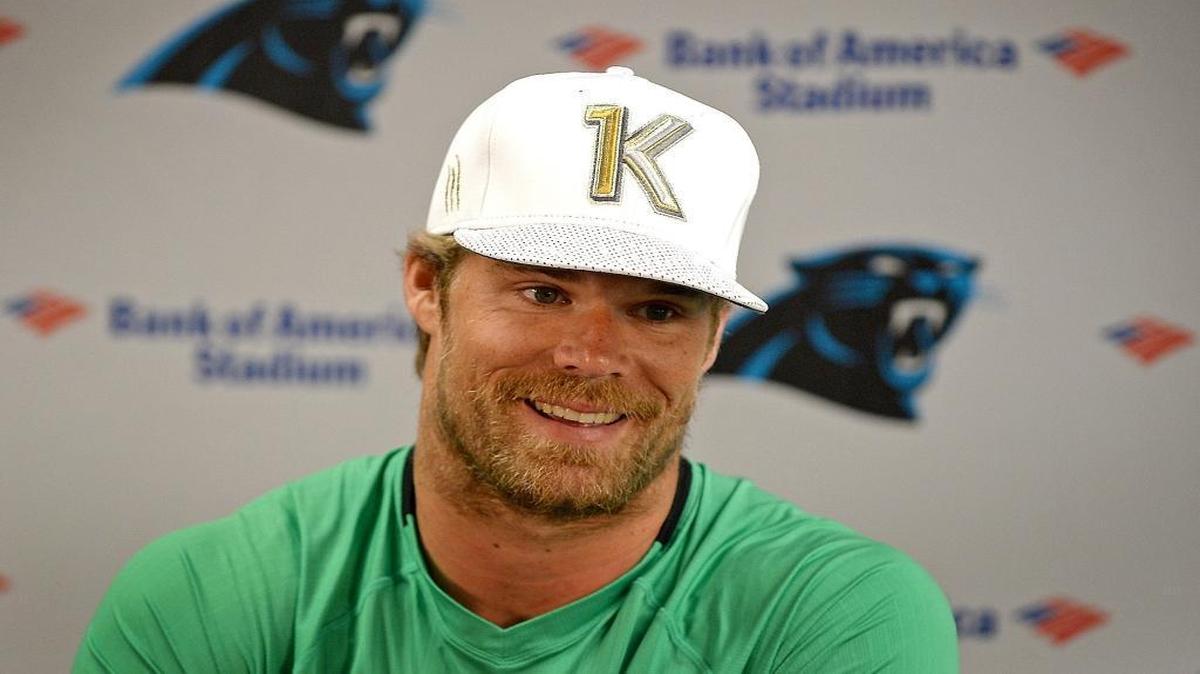 Carolina Panthers tight end Greg Olsen responds to a reporter's question in August. The hat Olsen is wearing was made by New Era and was presented to him after he became the first tight end in league history to record three consecutive seasons with 1,000 receiving yards.