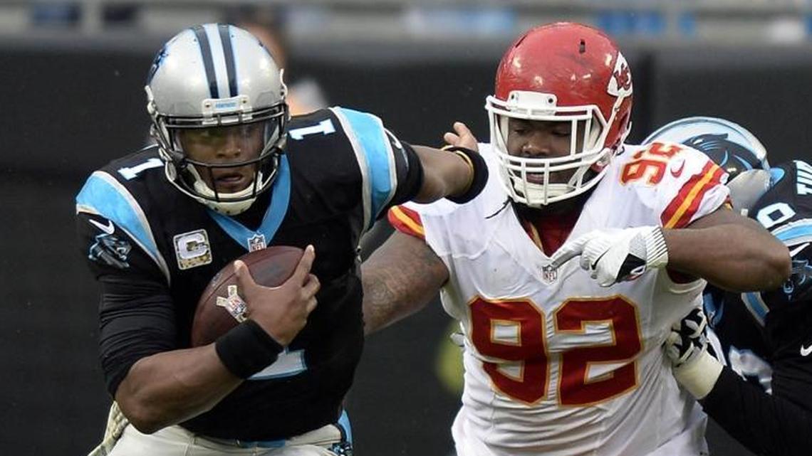 Carolina Panthers general Marty Hurney says Dontari Poe (92, chasing Cam Newton) is an “excellent fit” for the team at defensive tackle.