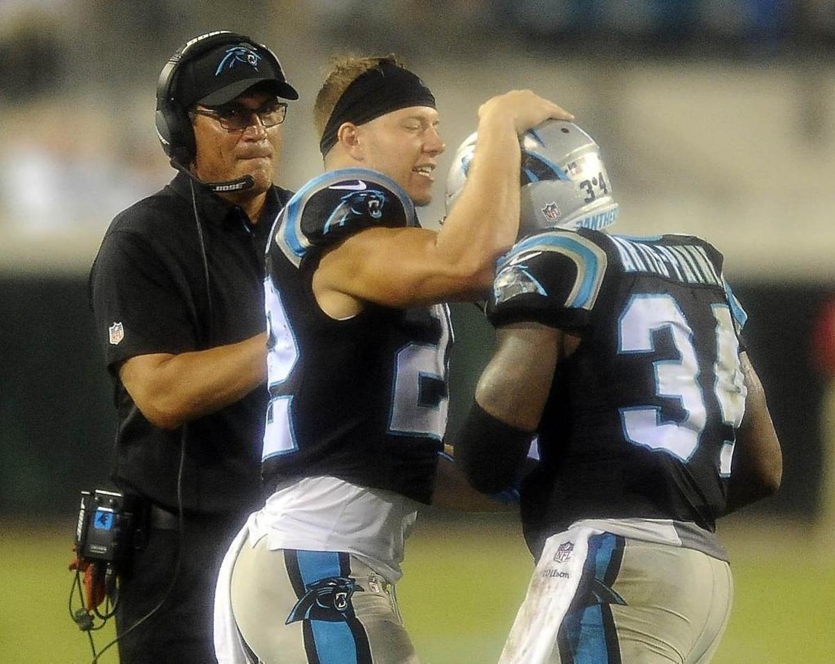 Cameron Artis-Payne (34) is congratulated by running back Christian McCaffrey (22) and coach Ron Rivera after one of his two touchdowns Thursday night. Artis-Payne has scored three times in the past two games as he fights for a roster spot.