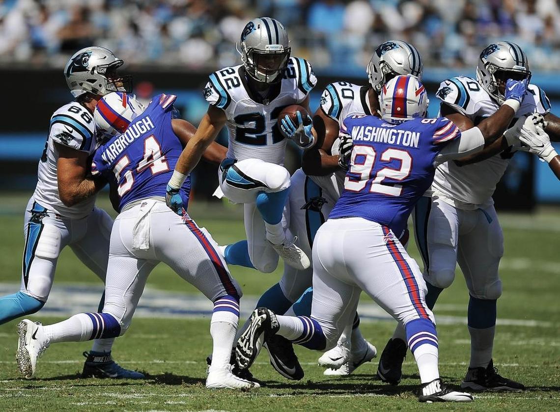 Carolina Panthers running back Christian McCaffrey (22) can occasionally hop through a gap on an inside run, as he did here against Buffalo, but the concept should be used sparingly.