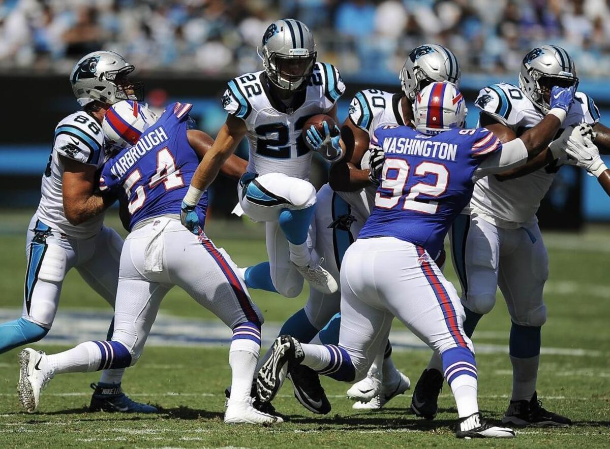 Carolina Panthers running back Christian McCaffrey (22) can occasionally hop through a gap on an inside run, as he did here against Buffalo, but the concept should be used sparingly.