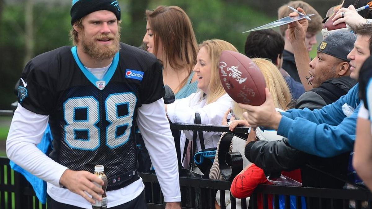 Greg Olsen greets fans before Panthers practice Thursday.