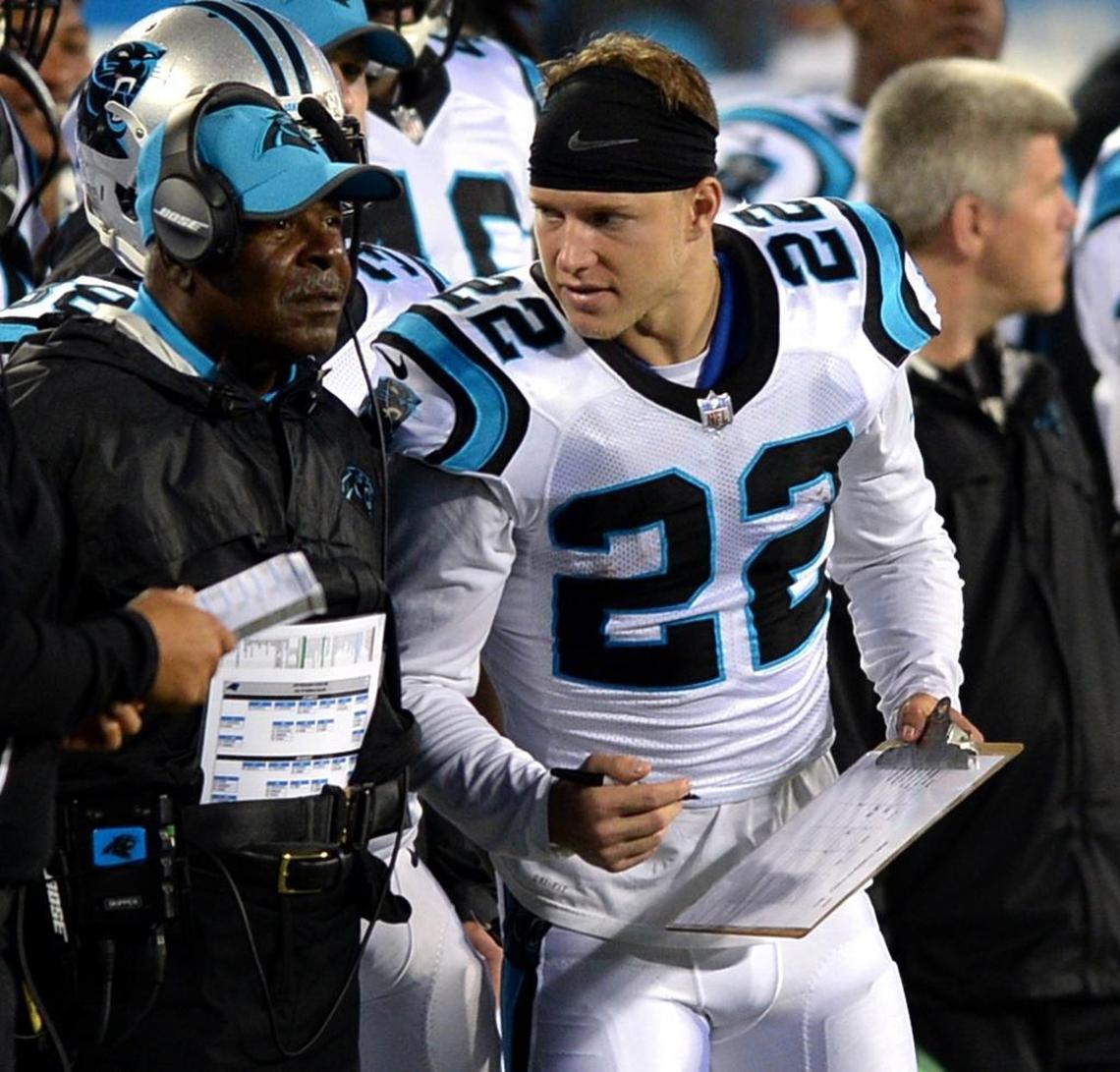 Carolina Panthers running backs coach Jim Skipper (left) is retiring at age 70 after 32 NFL seasons. He had a special bond with running back Christian McCaffrey (right).