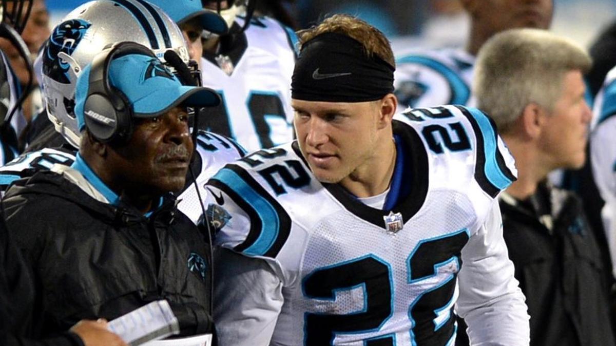 Carolina Panthers running backs coach Jim Skipper (left) is retiring at age 70 after 32 NFL seasons. He had a special bond with running back Christian McCaffrey (right).