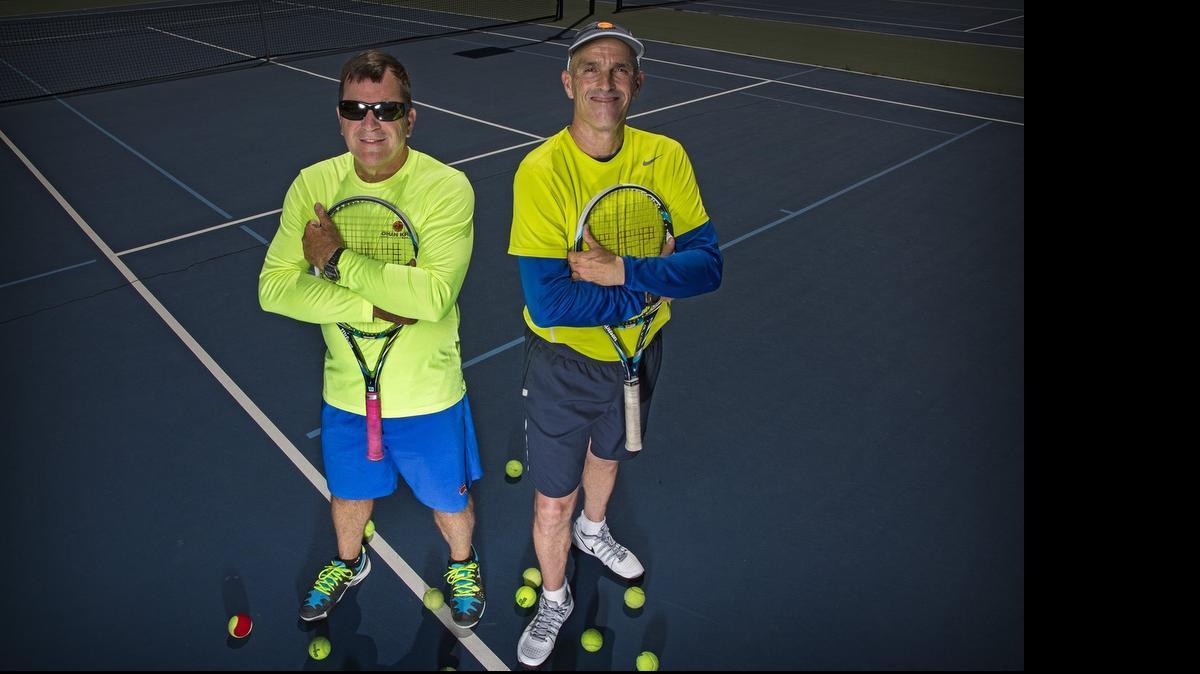 
Former world-ranked Top 25 tennis players Johan Kriek, left, and Tim Wilkison are teaming up to teach serious young tennis players in Charlotte. 
