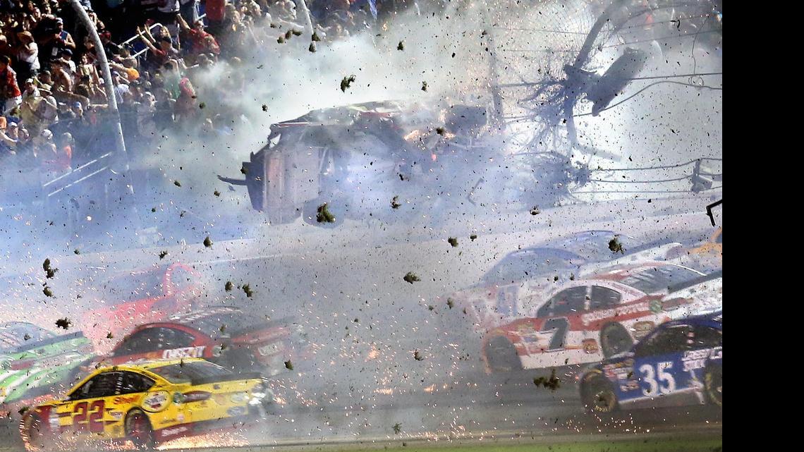 
Austin Dillon (3) goes airborne and hits the catch fence as he was involved in a multi-car crash on the final lap of the NASCAR Sprint Cup series auto race at Daytona International Speedway.
