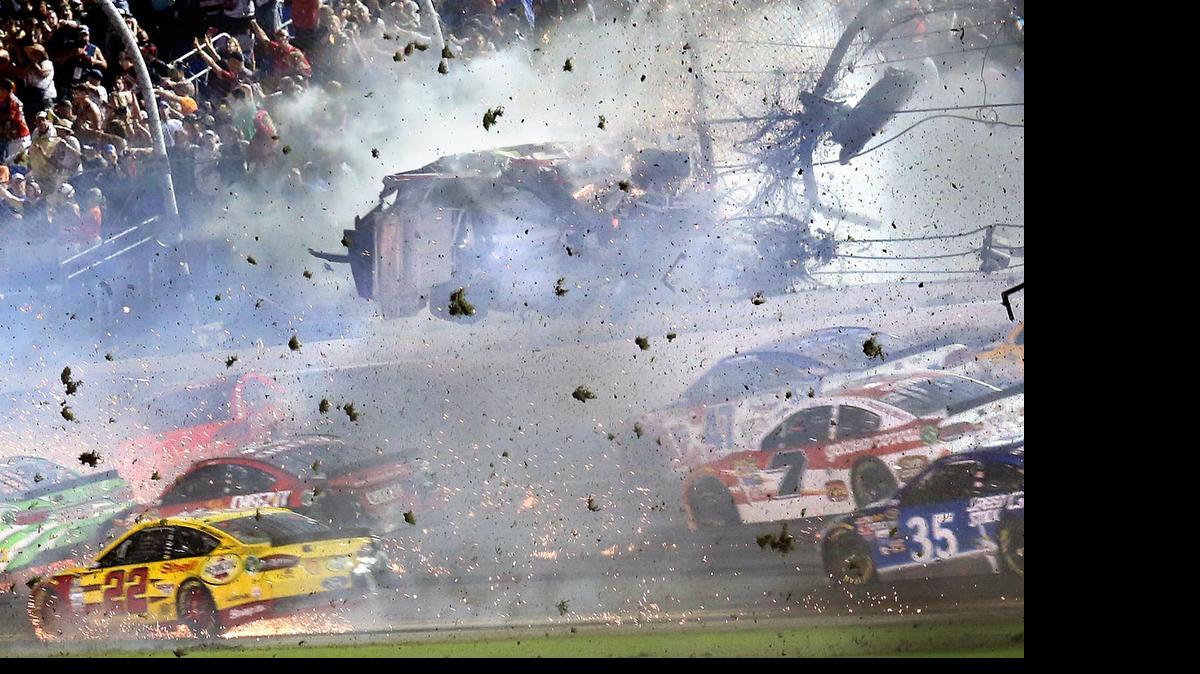 
Austin Dillon (3) goes airborne and hits the catch fence as he was involved in a multi-car crash on the final lap of the NASCAR Sprint Cup series auto race at Daytona International Speedway.
