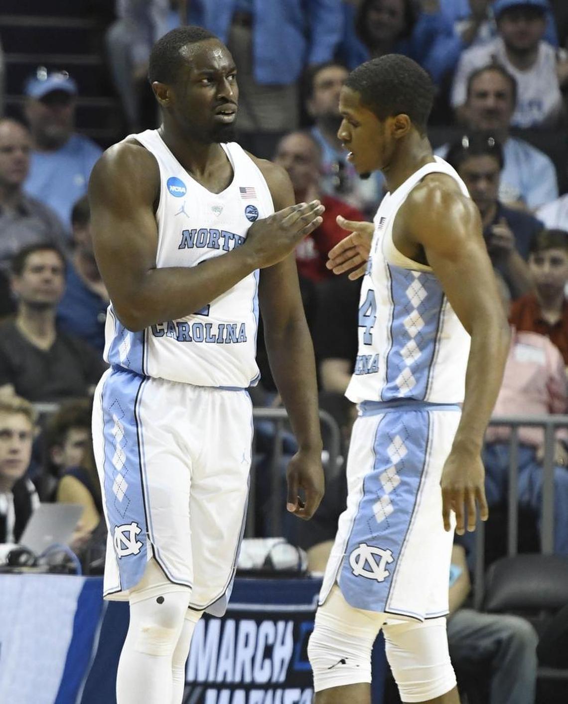 North Carolina’s Theo Pinson (left) slaps hands with guard Kenny Williams Friday during the Tar Heels’ 84-66 win over Lipscomb in the NCAA tournament.