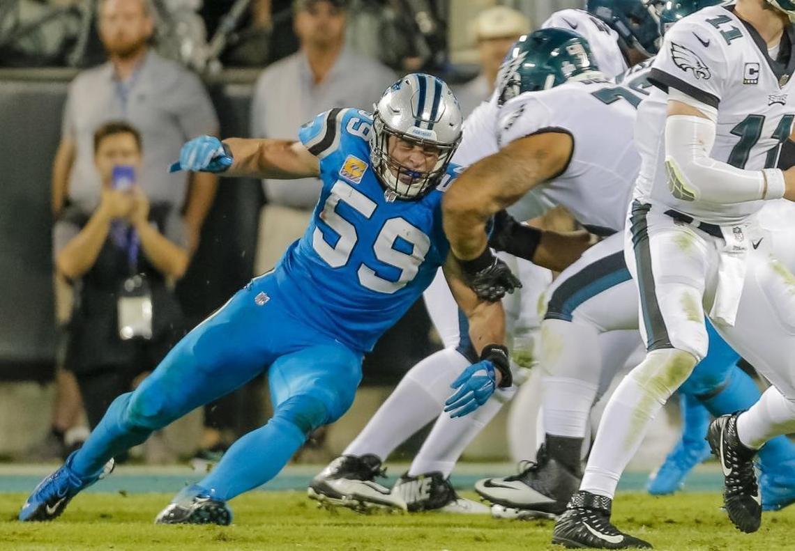 Carolina’s Luke Kuechly (59) banged the left side of his head on this second-quarter play against Philadelphia Thursday night. He missed the rest of the game due to a possible concussion.