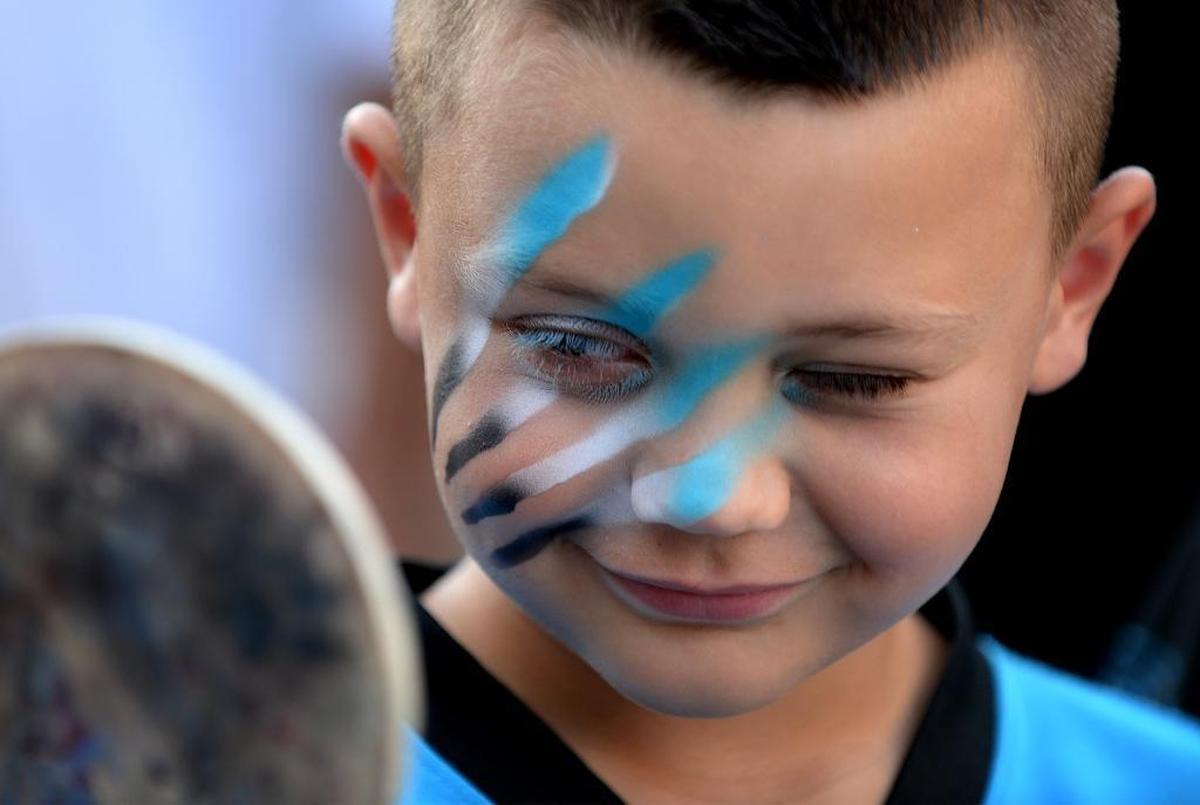Carolina Panthers fan L.T. Hipp had his face painted at the Panthers’ annual free Fan Fest at Bank of America Stadium in August 2017.