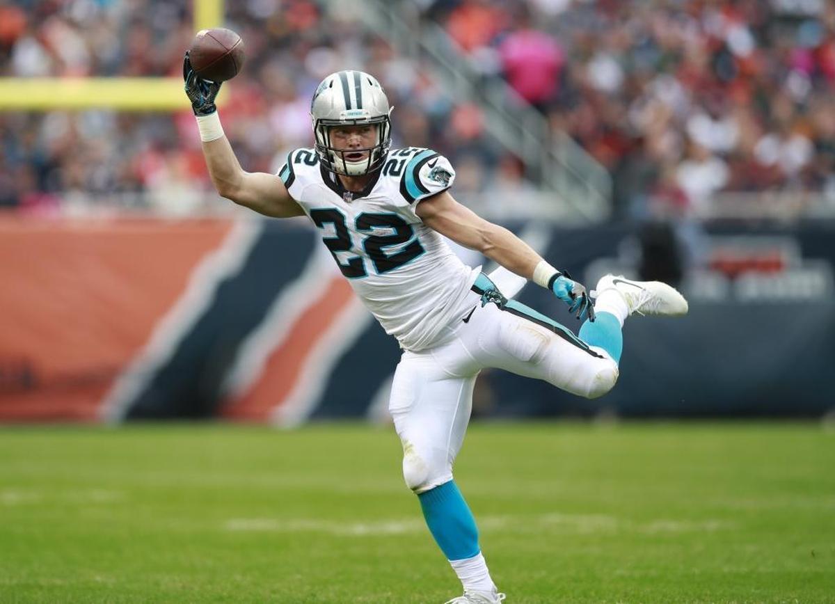 Carolina Panthers running back Christian McCaffrey (22), shown reeling in a one-handed catch against Chicago on Sunday, leads all NFL running backs in receptions (44) and is second among all running backs in receiving yards (329).