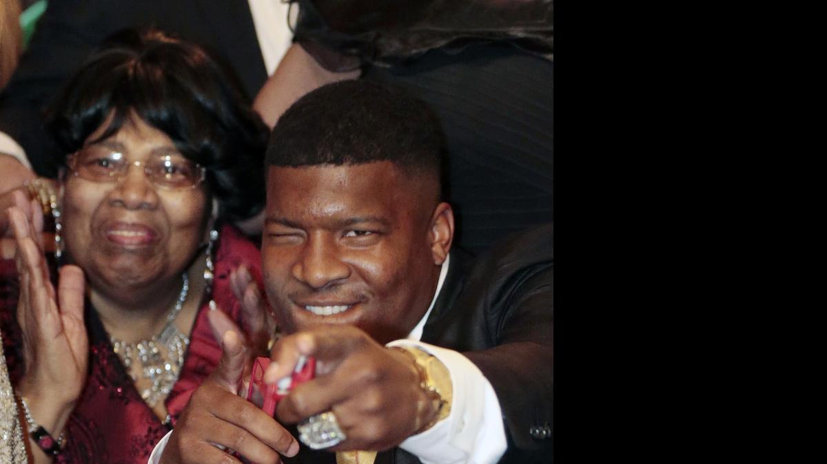 
Jameis Winston reacts to the announcement with his grandmother, Myrtle Winston, as the Tampa Bay Buccaneers select him as the No. 1 pick in the 2015 NFL Draft, Thursday, April 30, 2015, in Bessemer, Ala. 

