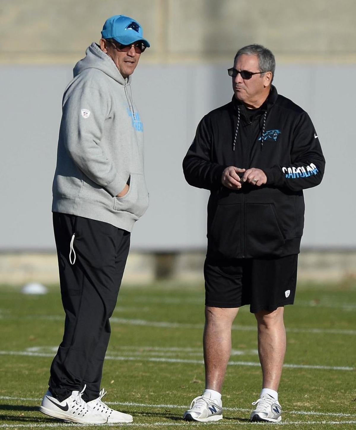 Carolina Panthers head coach Ron Rivera, left, talked with general manager Dave Gettleman during a 2016 practice. When Gettleman arrived in Charlotte in early 2013, he decided to keep Rivera (who at that time was 13-19 as Carolina’s head coach) instead of replacing him.