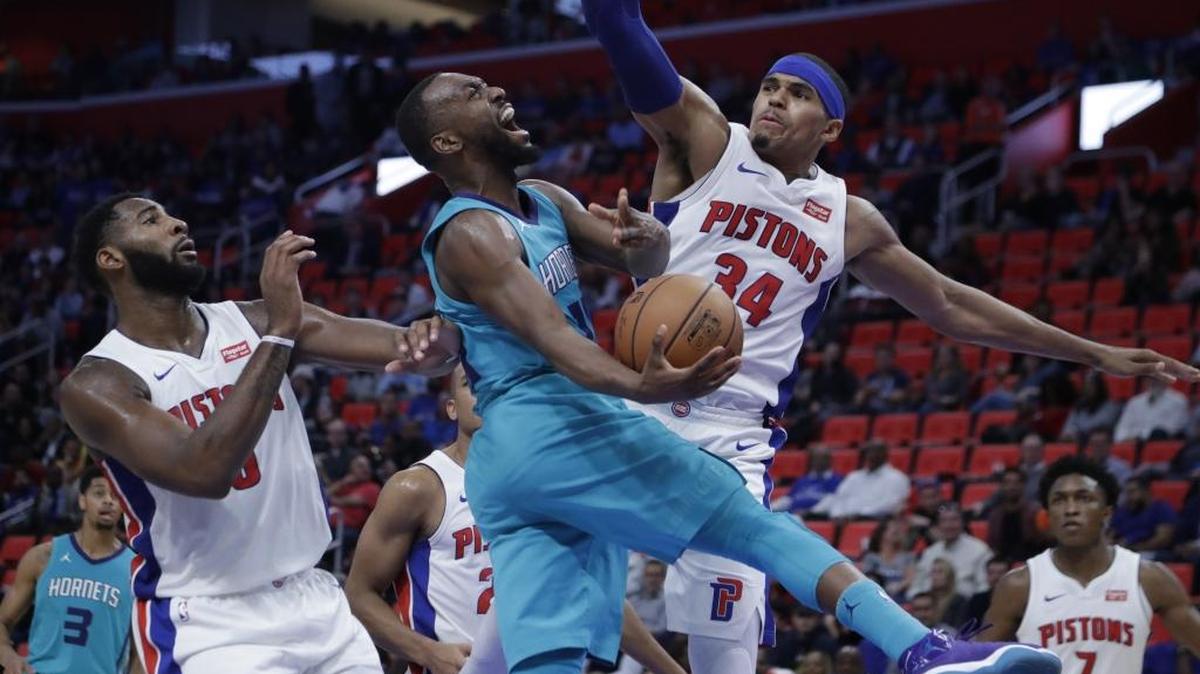 Charlotte Hornets guard Kemba Walker puts up a contested layup Wednesday night against Detroit. Walker had a team-high 24 points in the Hornets’ opening-night loss.