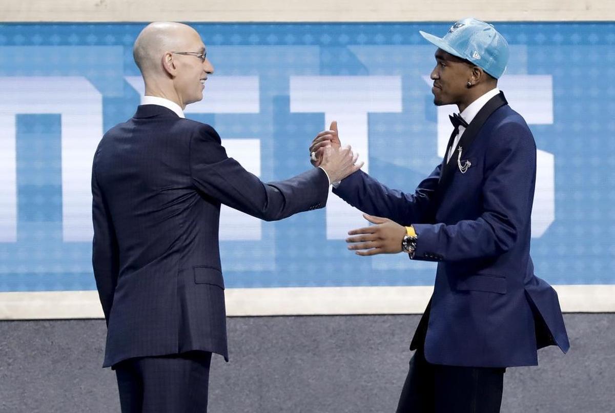 Kentucky's Malik Monk, right, is greeted by NBA Commissioner Adam Silver after being selected by the Charlotte Hornets as the 11th overall pick during Thursday’s draft in Brooklyn.
