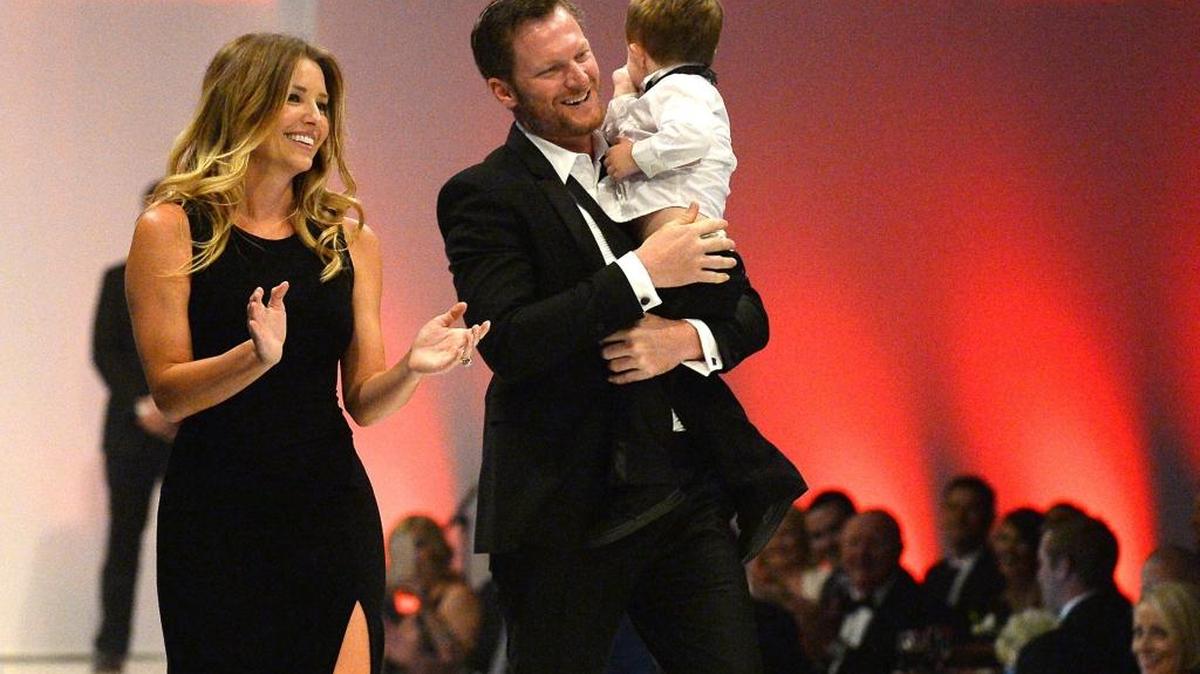 Amy Earnhardt, left with husband Dale Earnhardt Jr., center, walk together during the Catwalk for a Cause casino night and charity event at the Statesville Municipal Airport with Camden (back to camera) on May 18th. Earnhardt and Amy were married on New Year’s Eve and have spoken openly about wanting to have their own children one day.