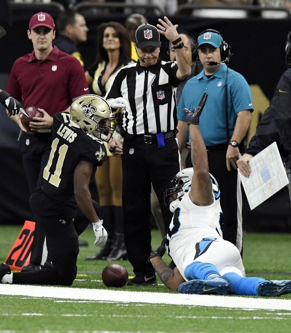 Carolina Panthers defensive end Julius Peppers (90) pleaded not to be penalized on this play when he threw Saints receiver Tommylee Lewis (11) down out of bounds. But he was, giving the Saints another chance on a drive in which New Orleans would score a touchdown.