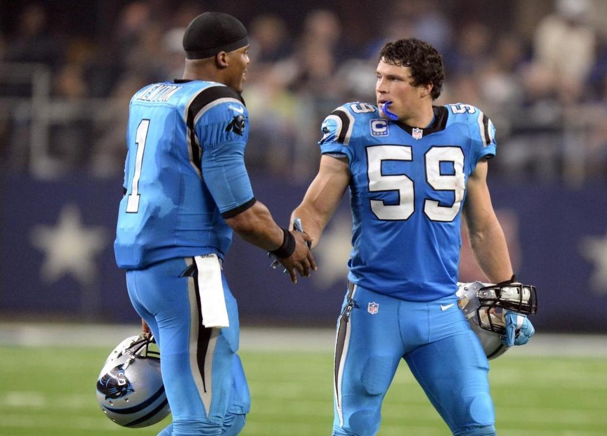 Carolina Panthers' Cam Newton (1) and Luke Kuechly (59) slap hands in 2015. Newton was the NFL’s Most Valuable Player that season after accounting for 45 touchdowns. Kuechly was named the NFL’s Defensive Player of the Year in 2013, only his second NFL season.