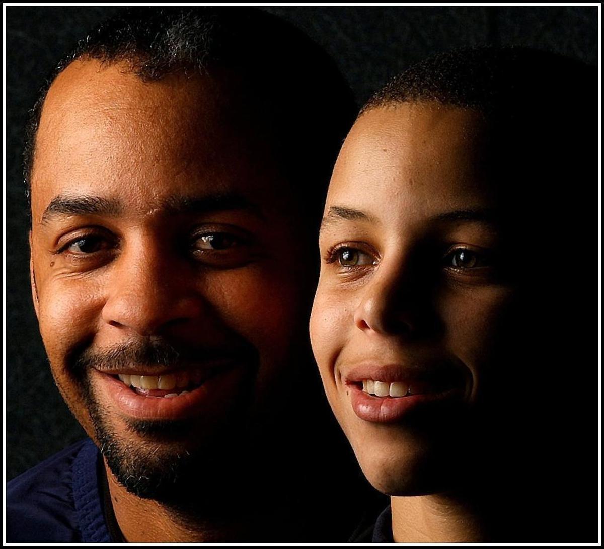 In this 2004 photo, Dell Curry was already watching son Steph Curry -- but Steph was in high school at Charlotte Christian. The school retired Steph Curry’s number last week.