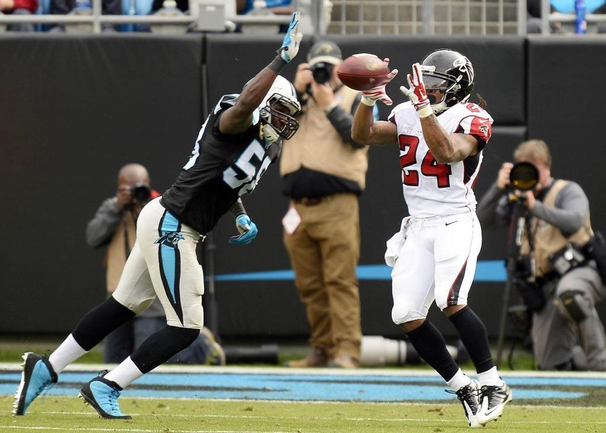 Carolina Panthers outside linebacker Thomas Davis (58) reached for the ball last December while defending Atlanta Falcons running back Devonta Freeman (24) in a game Atlanta won, 33-16.