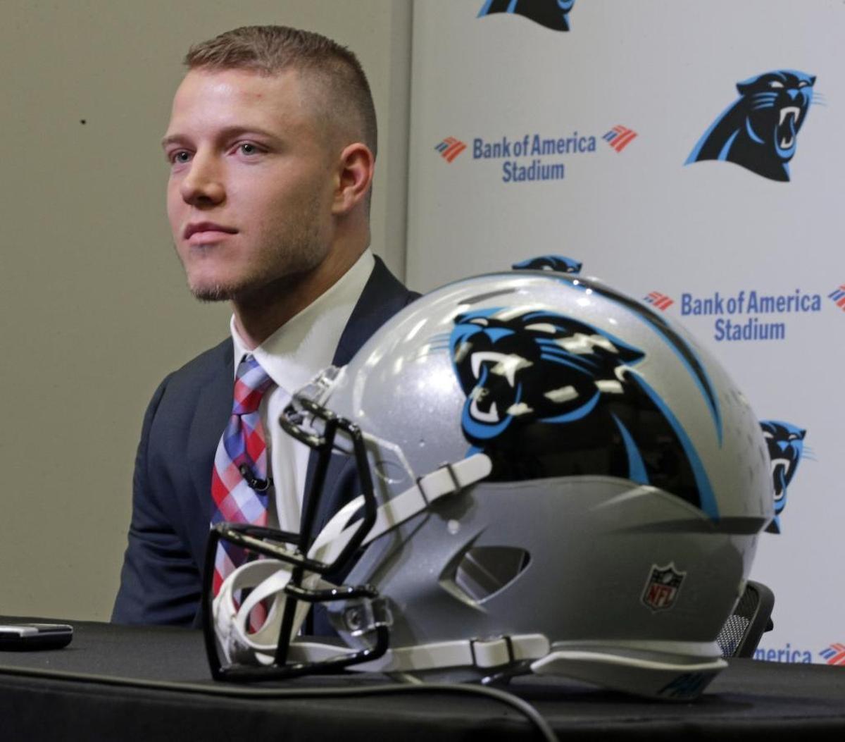 Carolina Panthers first-round draft pick Christian McCaffrey listens to a question during a news conference in Charlotte Friday.