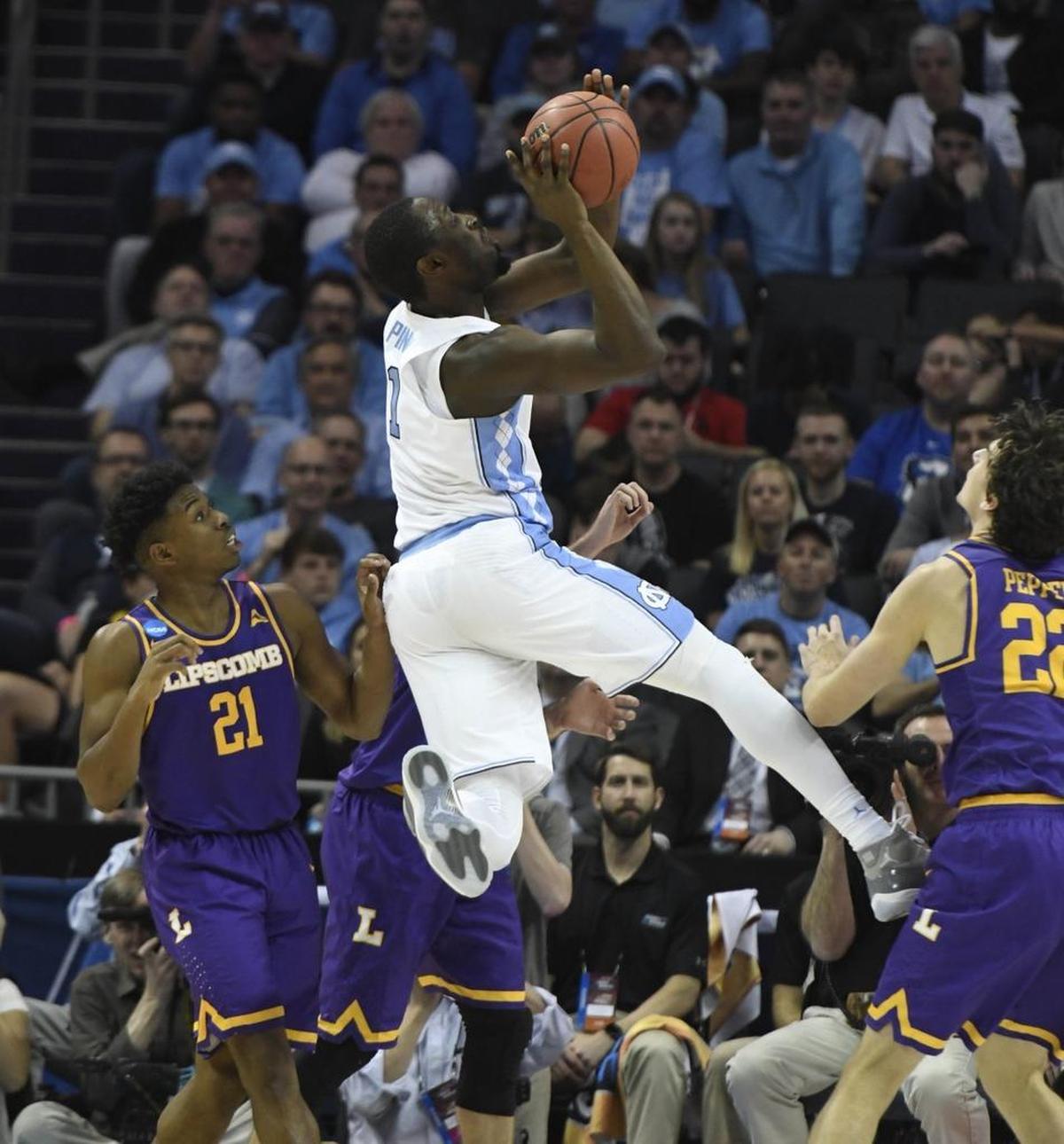 North Carolina forward Theo Pinson shoots against Lipscomb Friday. The Tar Heels won the game by 18 points, then watched at their hotel room in disbelief as No. 1 seed Virginia lost to No. 16 seed UMBC later the same day.
