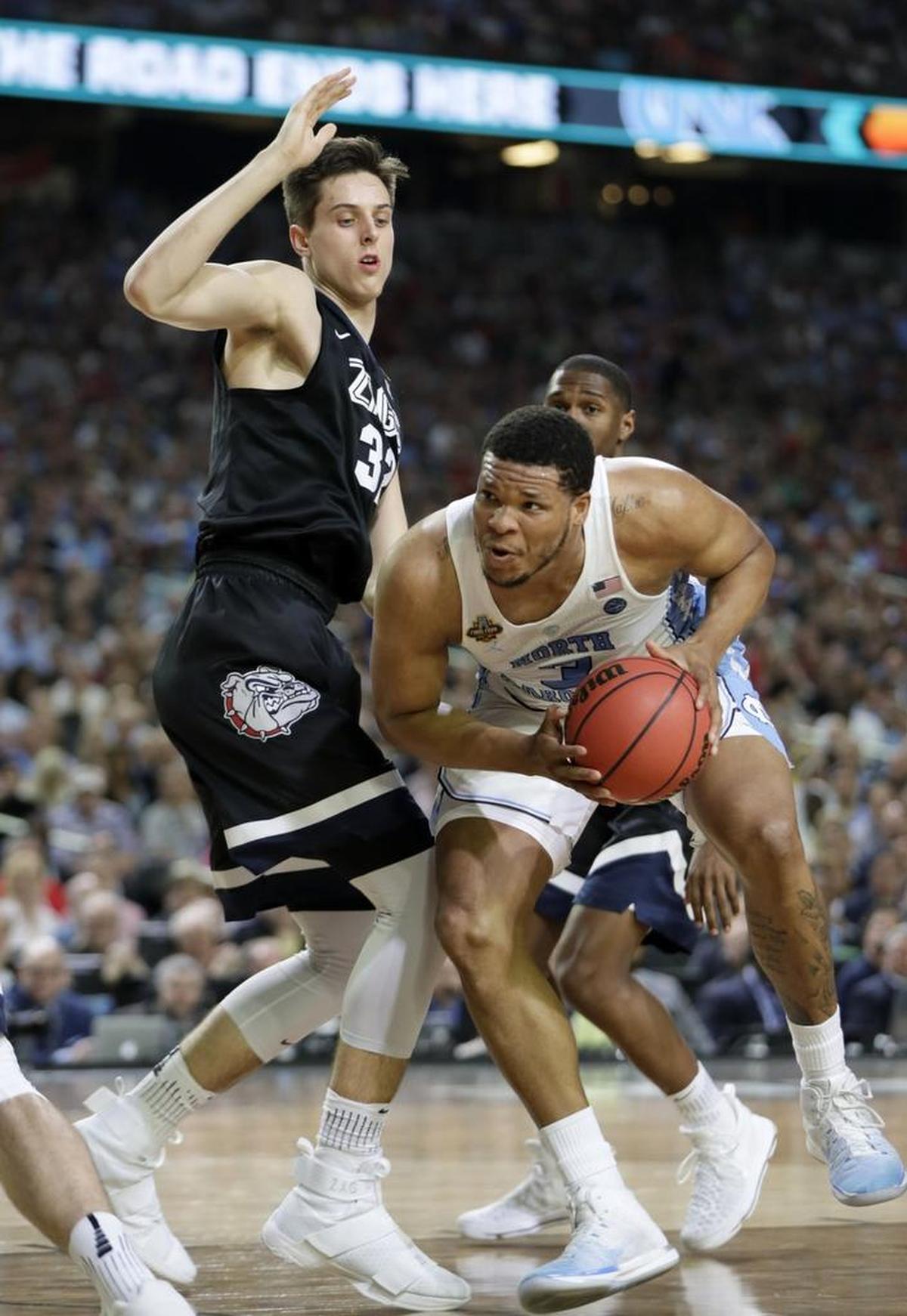 Zach Collins (left), shown defending North Carolina's Kennedy Meeks in the Final Four, would not be a good fit for the Charlotte Hornets after the Dwight Howard trade.