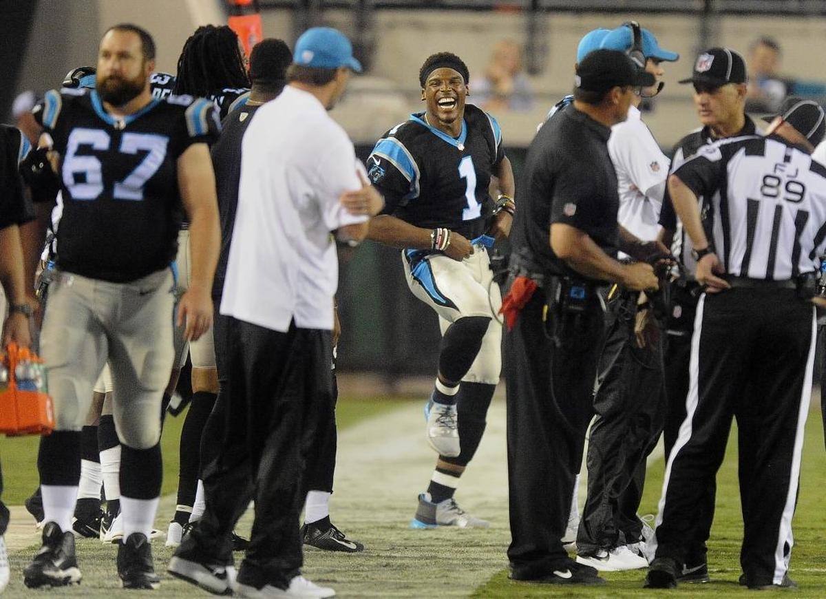 Carolina Panthers quarterback Cam Newton had so much time on the sideline Thursday night that he spent part of it dancing on the sideline to the general amusement of his teammmates -- although center Ryan Kalil (67) looks unimpressed.