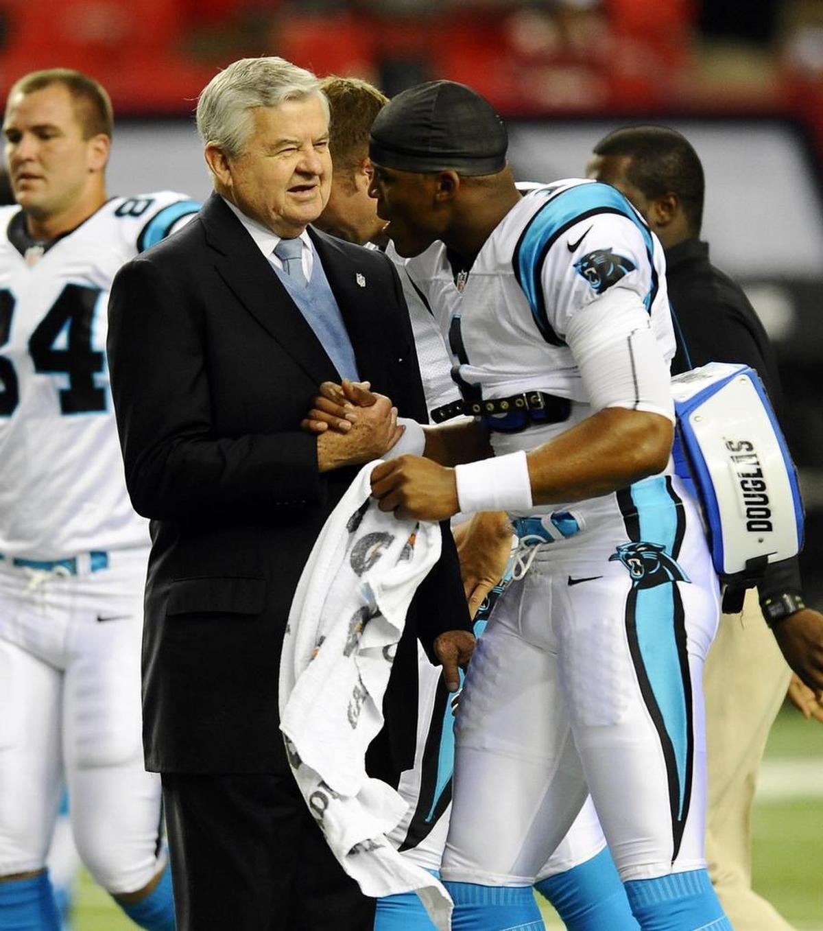 Carolina Panthers owner Jerry Richardson greets Cam Newton (1) before a game in 2012. Newton said Wednesday he was originally “disgruntled” when Richardson told him Sunday that he was going to sell the Panthers.