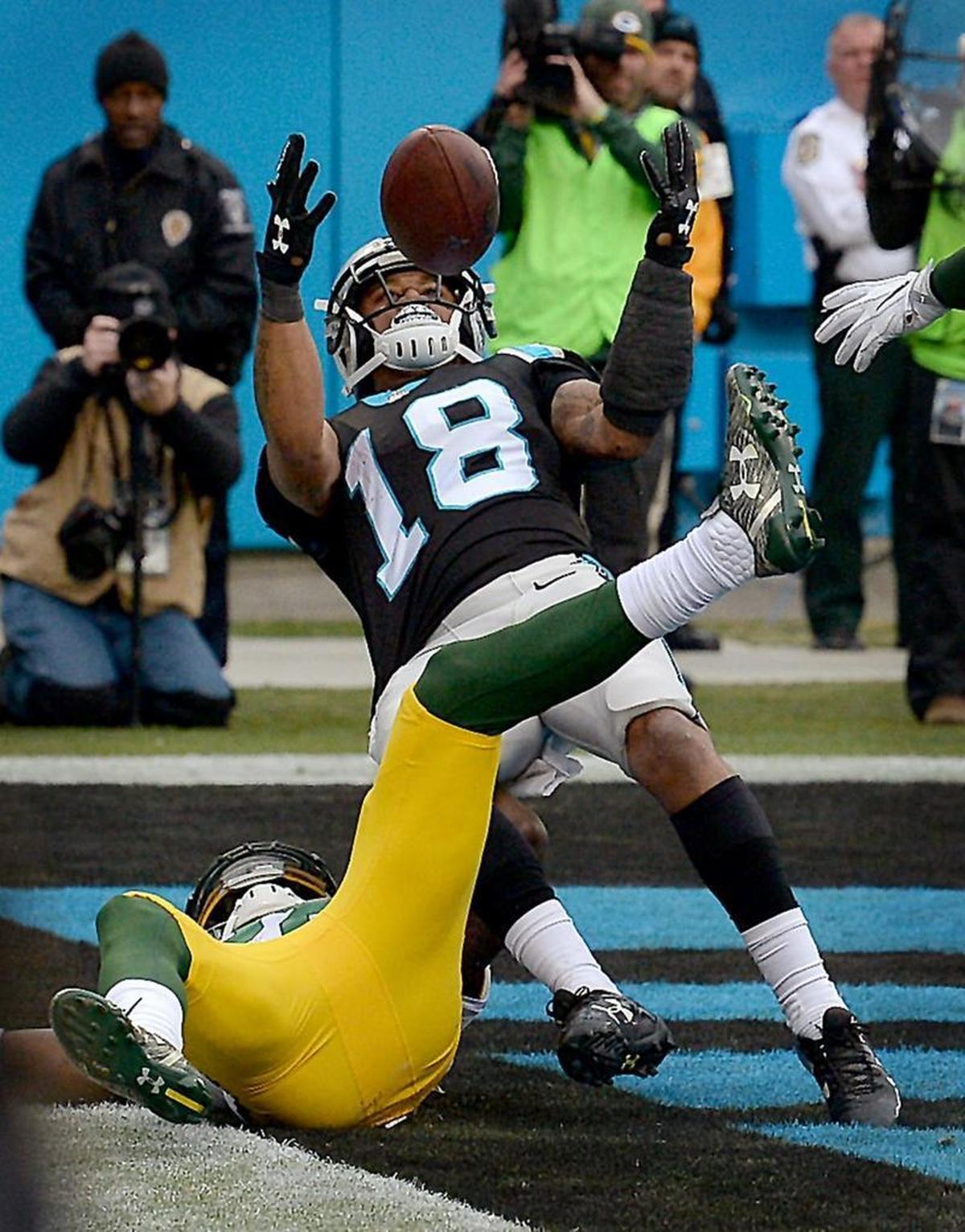 Carolina Panthers wide receiver Damiere Byrd reaches out to grab control of the touchdown pass in which “the left side of his rear end hit inbounds,” as the head referee would later say.