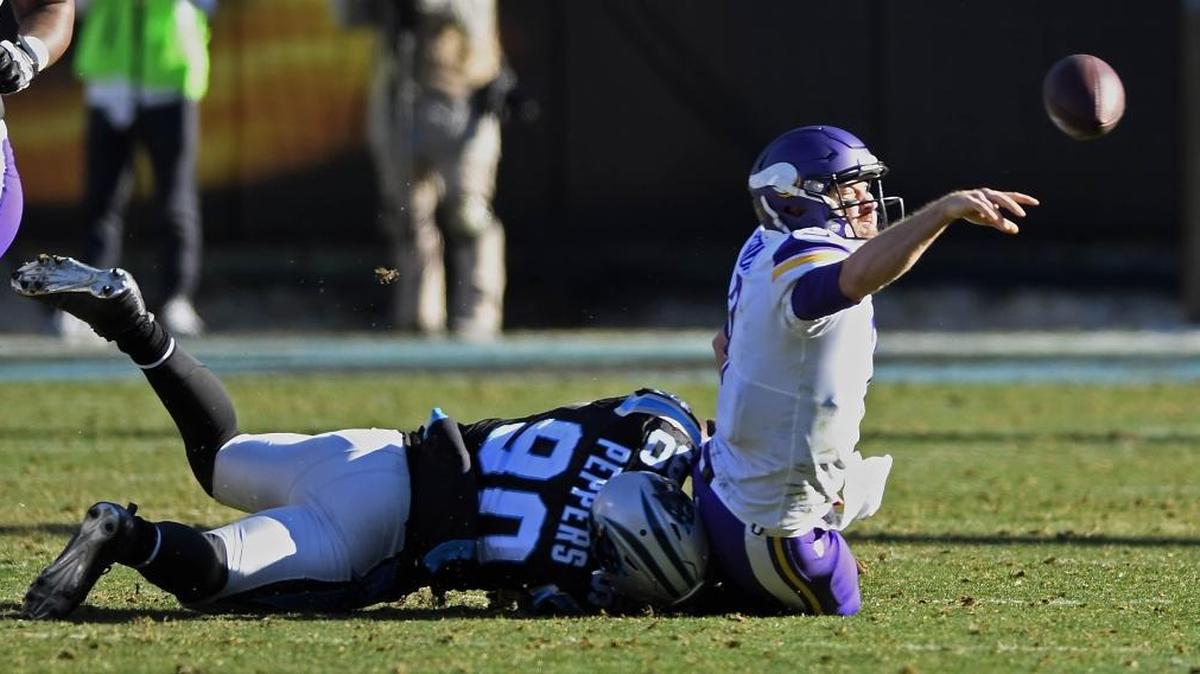Carolina defensive end Julius Peppers (90) with one of his 11 sacks this season -- of Minnesota quarterback Case Keenum. Peppers, 37, says this Panthers defense is the best he has played on in his entire career.