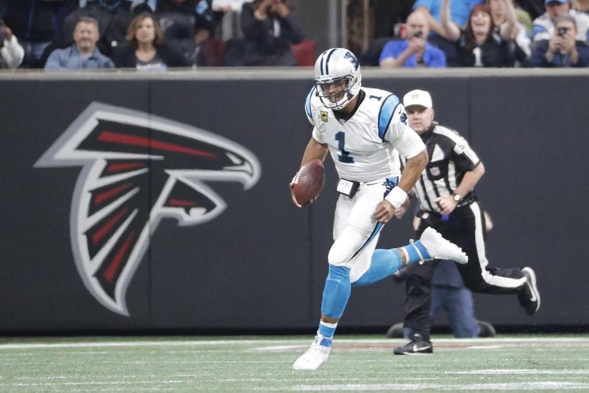 Carolina Panthers quarterback Cam Newton (1) runs out of the pocket on a 17-yard scramble against Atlanta Sunday.