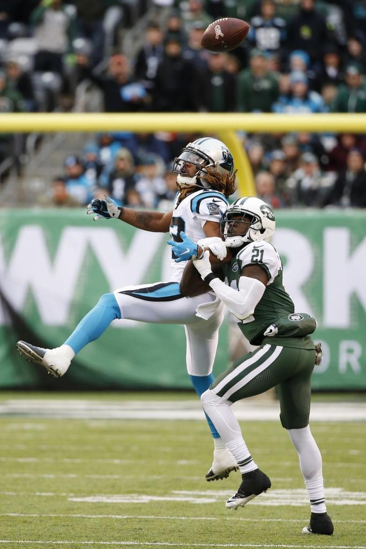 New York Jets cornerback Morris Claiborne, right, breaks up a pass intended for Carolina Panthers wide receiver Kaelin Clay.