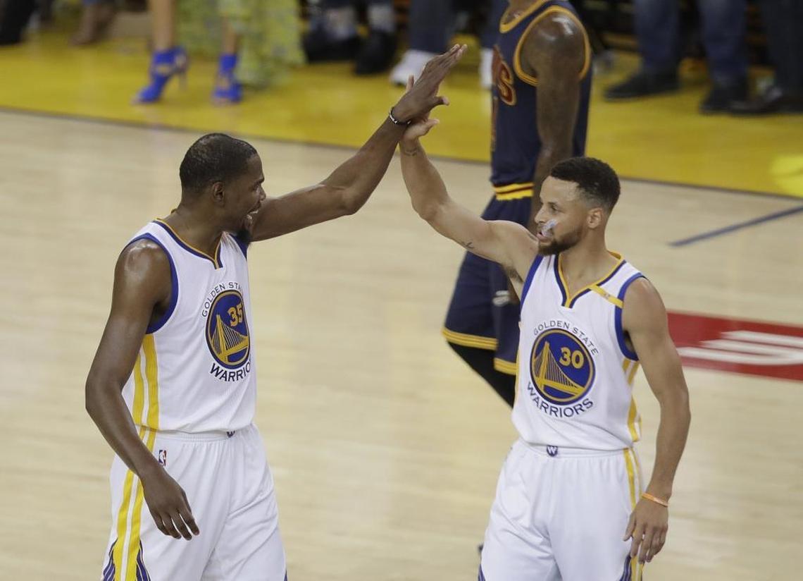 Kevin Durant (left) and Steph Curry combined to win an NBA championship in June for the Golden State Warriors in their first year together as teammates.