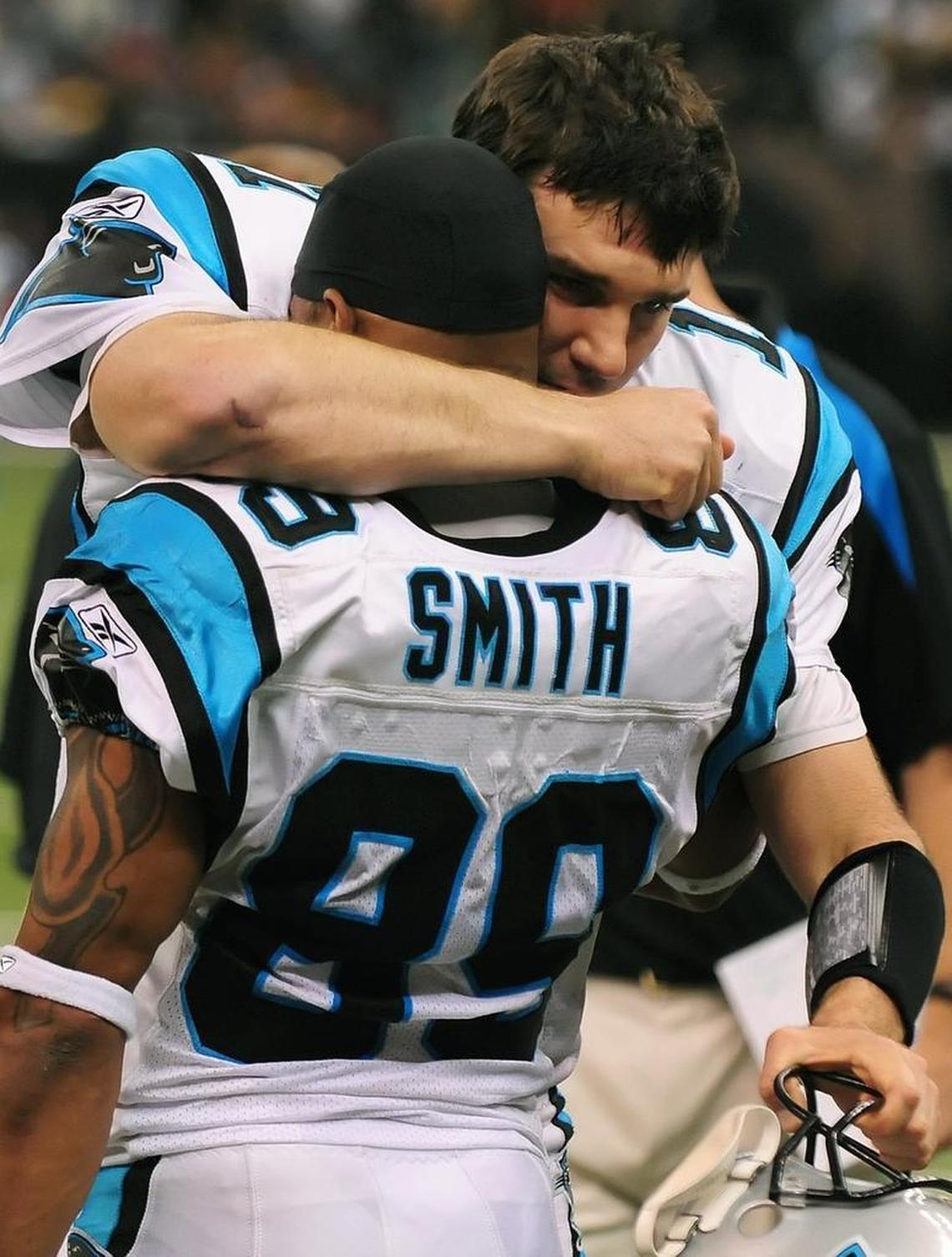 Quarterback Jake Delhomme and wide receiver Steve Smith hug after a 2008 Carolina win over New Orleans. Delhomme quarterbacked the Panthers to five playoff wins -- still a team record.
