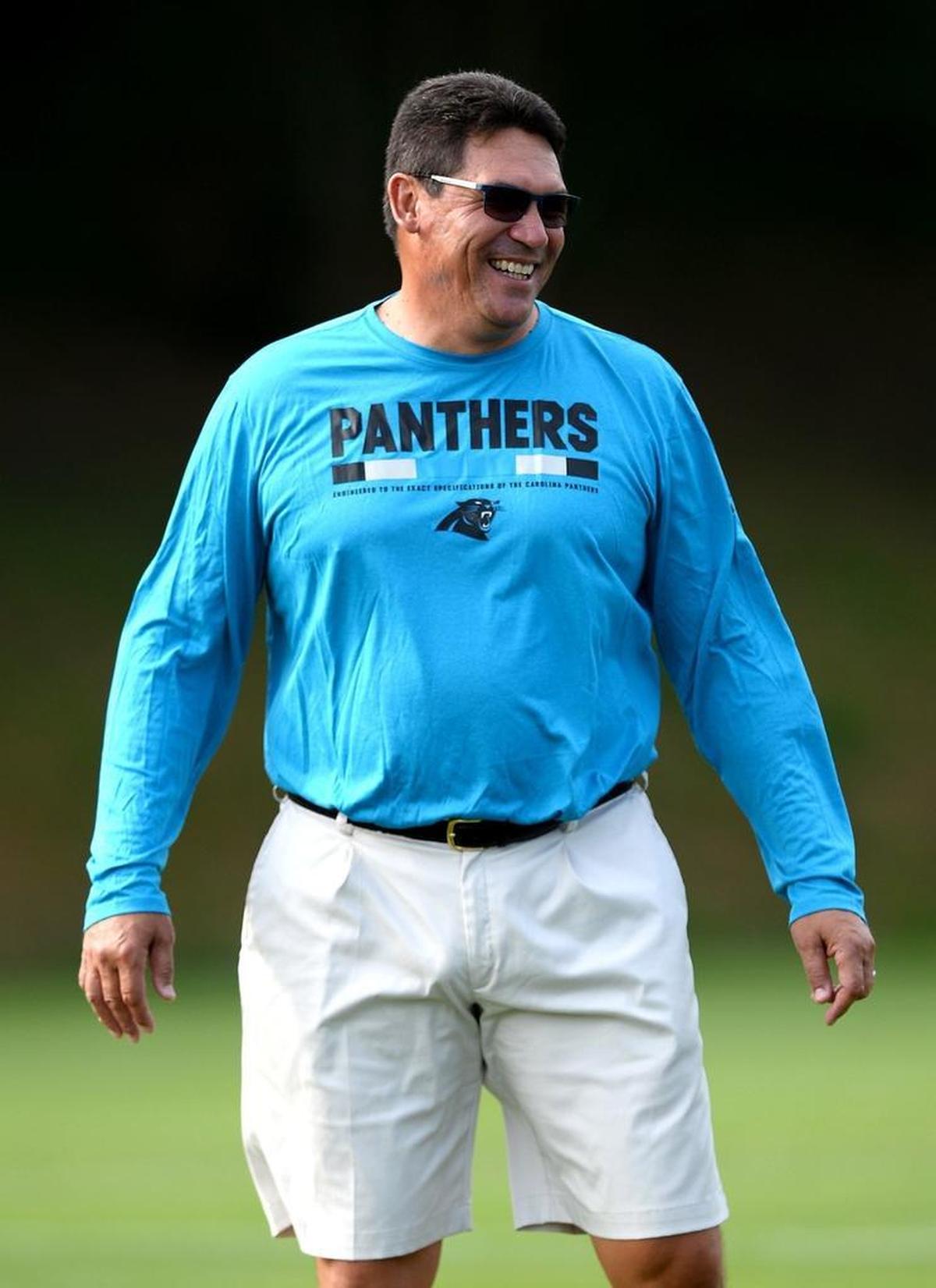 Carolina Panthers head coach Ron Rivera jokes with defensive end Charles Johnson prior to a practice. Rivera told the team at its first training-camp meeting in late July that “the intent is to win it all” in 2017.
