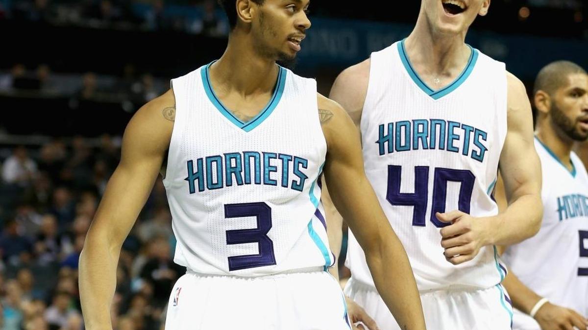 The Charlotte Hornets’ Jeremy Lamb, left, and Cody Zeller react after a basket Tuesday in the team’s 130-105 win against Chicago. Lamb scored a team-high 20 points in his first game since signing a $21-million contract extension
