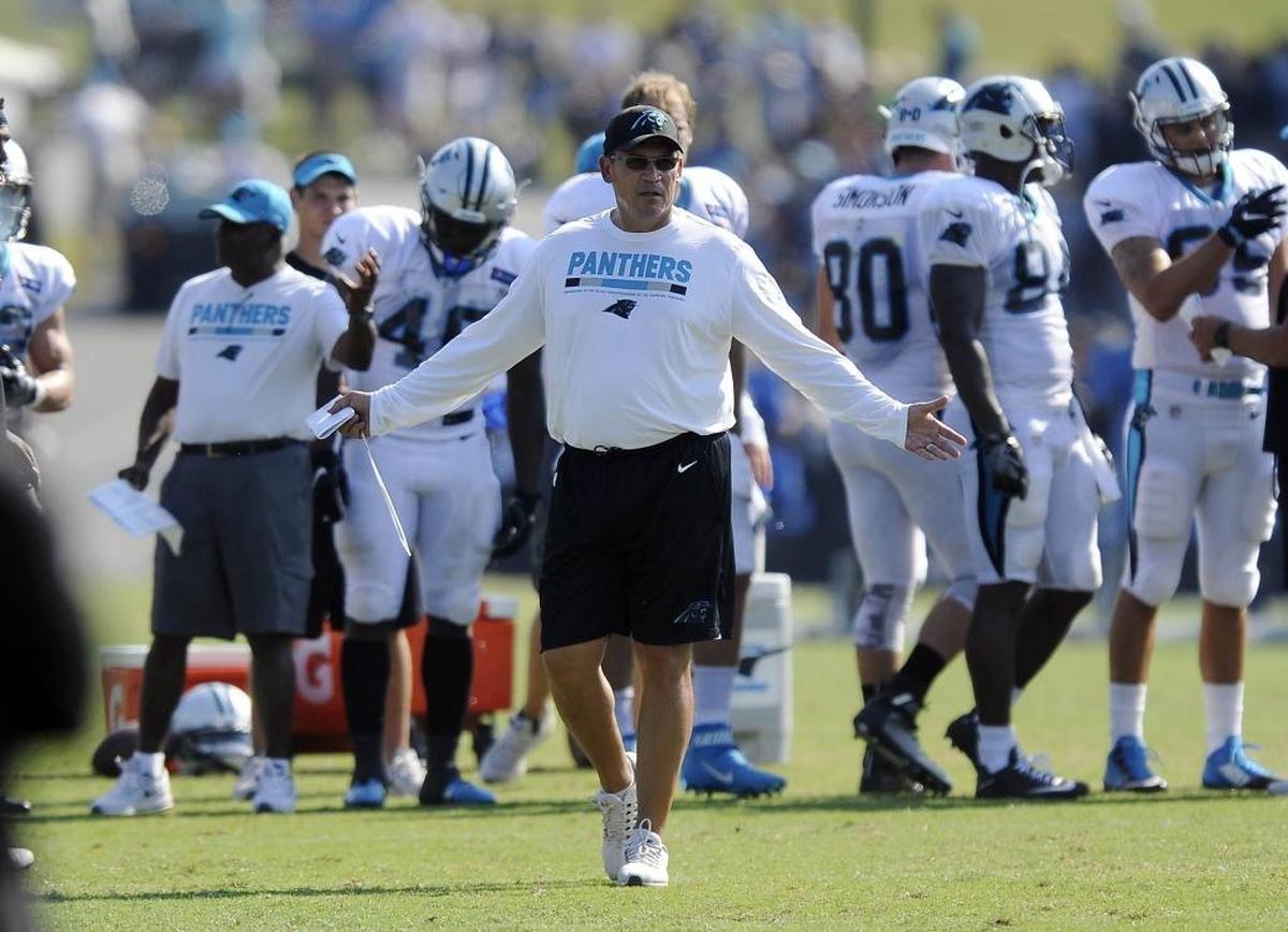 Carolina Panthers head coach Ron Rivera gestures toward the sideline Sunday during a training camp practice.
