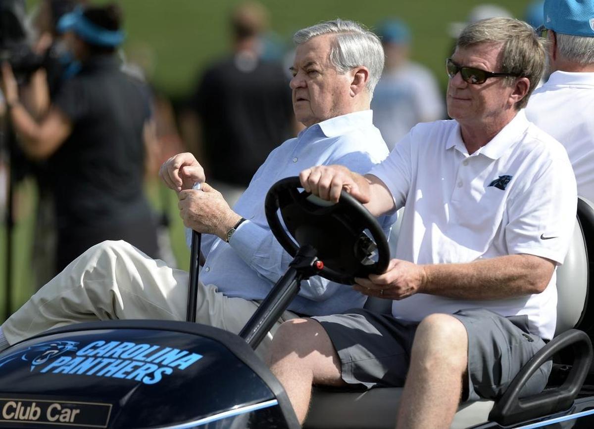 Carolina Panthers owner Jerry Richardson, left, remains under investigation for sexual misconduct. Meanwhile, general manager Marty Hurney (driving) has been reinstated to his job after his own brief investigation.