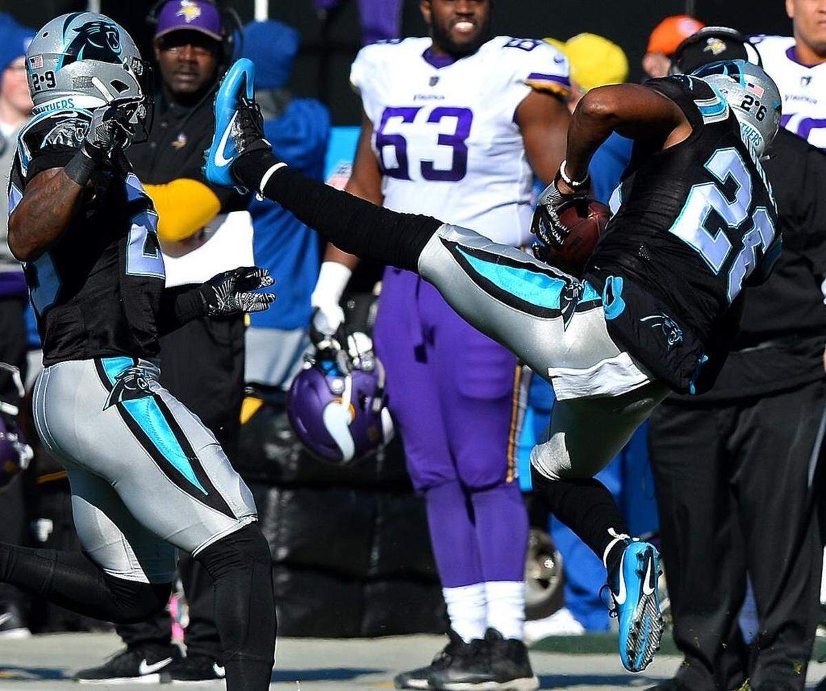 Carolina Panthers cornerback Daryl Worley, right, intercepts a pass by Minnesota Vikings quarterback Case Keenum during first-quarter action on Sunday, Dec. 10, 2017 at Bank of America Stadium.