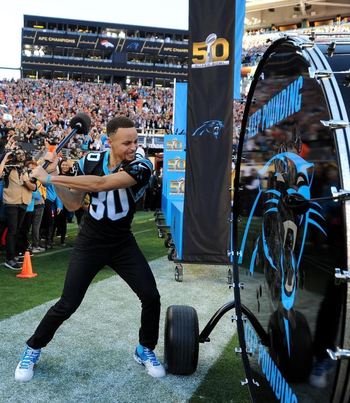 NBA star and diehard Panthers fan Stephen Curry grits his teeth as he bangs the Carolina Panthers “Keep Pounding” drum prior to the Super Bowl in Santa Clara, Calif., on Feb. 7, 2016.